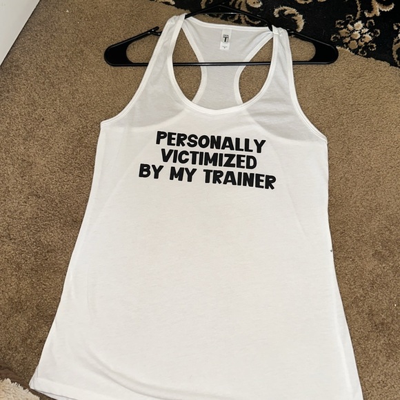 White tank “. Personally victimized by my Trainer”. - Picture 2 of 8
